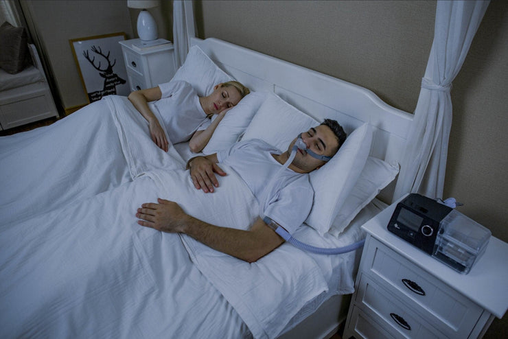 Man with Sleep Apnea using an AutoCPAP Machine